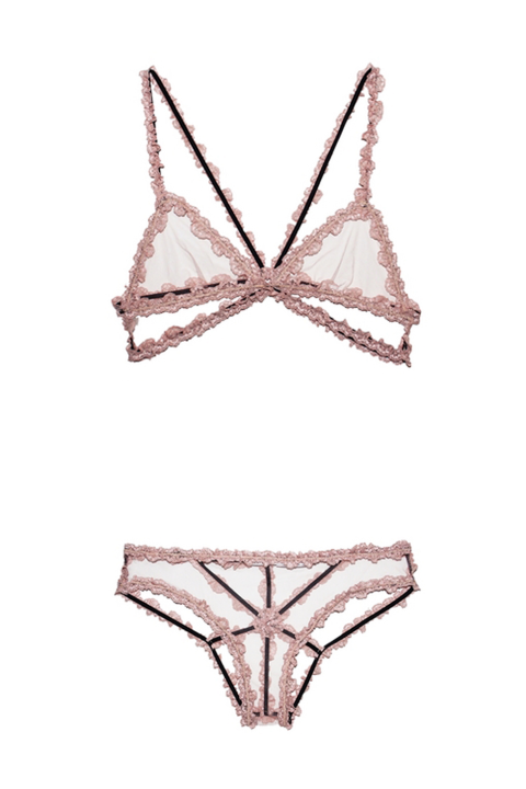 Don't be fooled by this set's innocent-looking pale pink hue–these pieces are red-hot thanks to some strategic straps in back.
Lace Bondage Triangle Bra, $125 and Panty, $85; fleurdumal.com.
