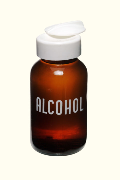 Rubbing alcohol is a natural astringent and thus absorbs dirt and oil. Pour a small amount on a cotton ball and swipe it over your shiny spots as your on-the-fly toner.