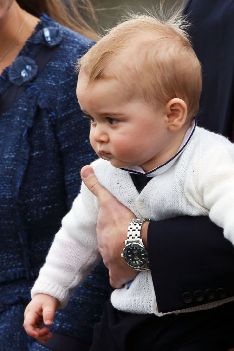 What does Great Britain's youngest heir wear underneath his favorite sweaters? More often than not, it's a classic Peter Pan collar. Whether it's a simple white one, like we saw him sport when George and company disembarked in New Zealand, or white with navy piping, like he wore underneath his sailboat-sporting shortalls during one of his play dates.