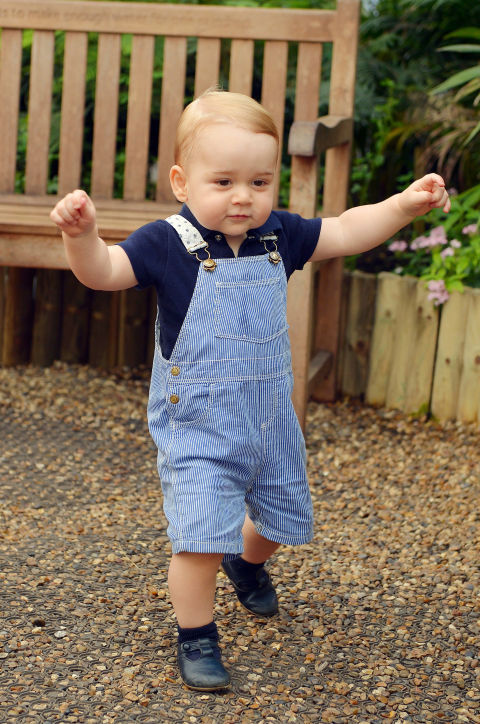 Prince George may caught some flack for sporting what appeared to be a pair of pink overalls to Dad Prince William's polo match this past Father's Day (see slide 5), but the critics just weren't looking close enough. George's shortalls were clearly red and white seersucker. This wasn't the first time George rocked the preppy print. He wore red seersucker while on tour with mom and dad in Australia. Not to mention, that in the Palace's official birthday photo of George, he's rocking the print in blue.