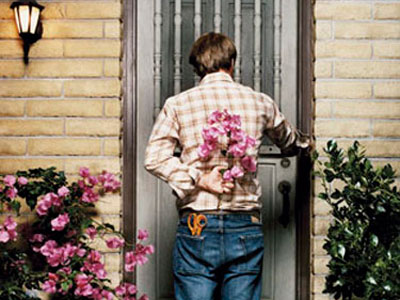 guy with flowers ringing doorbell